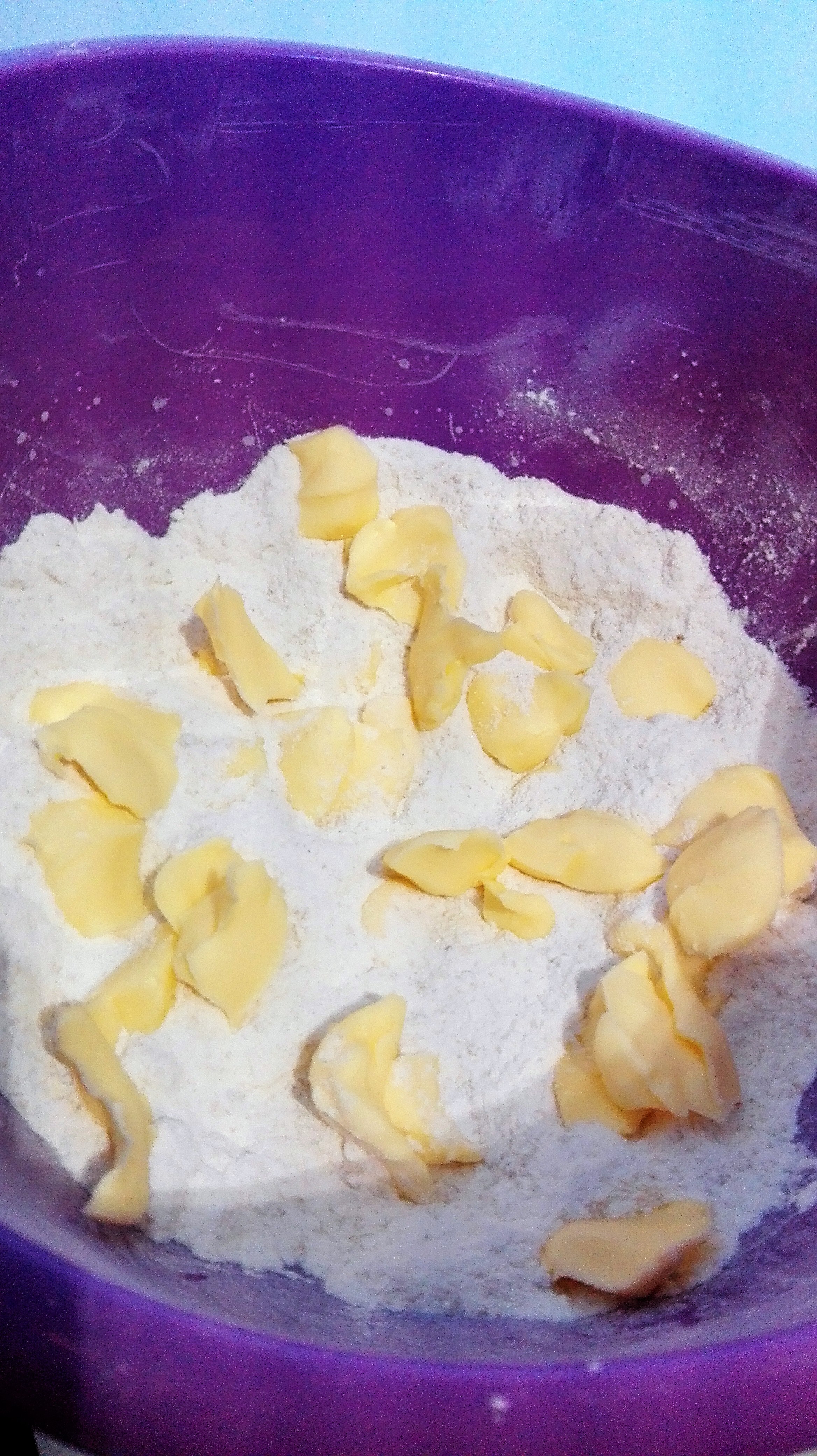 ginger sponge parkin recipe ingredients in a purple mixing bowl