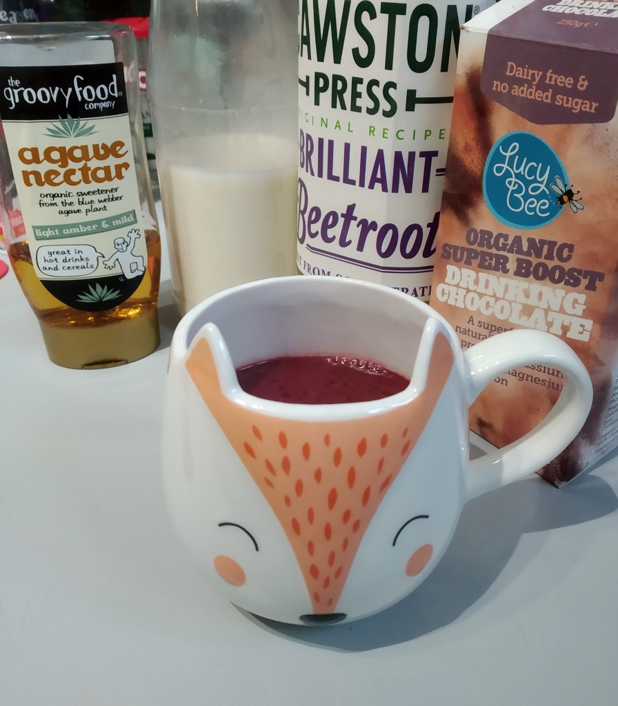 beetroot pink hot chocolate in a fox mug with agave syrup, oat milk, beetroot juice and cocoa powder