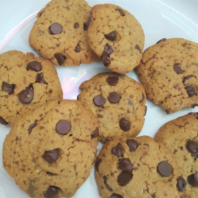 allergy friendly dark chocolate chip cookies with stem ginger on a plate